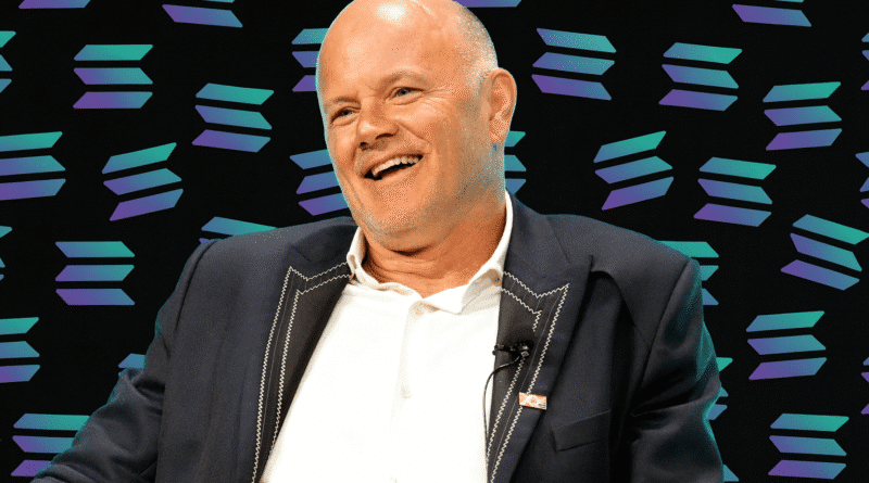 Solana Season Kicks Off as Novogratz Sees Billions Flowing In Mike Novogratz in suit at conference Solana backdrop
